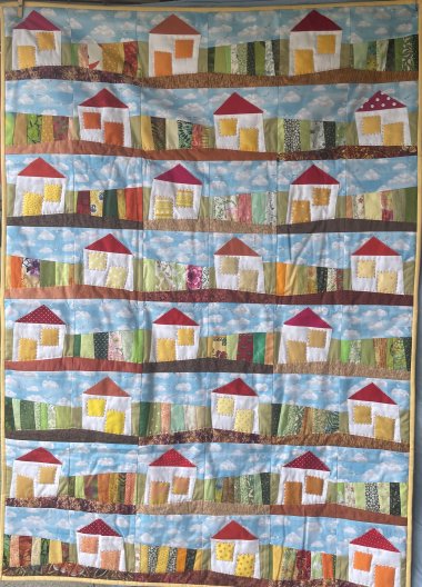 Ein Quilt mit vielen bunten Häusern von Geertje Theis Ein Quilt mit vielen bunten Häusern von Geertje Theis